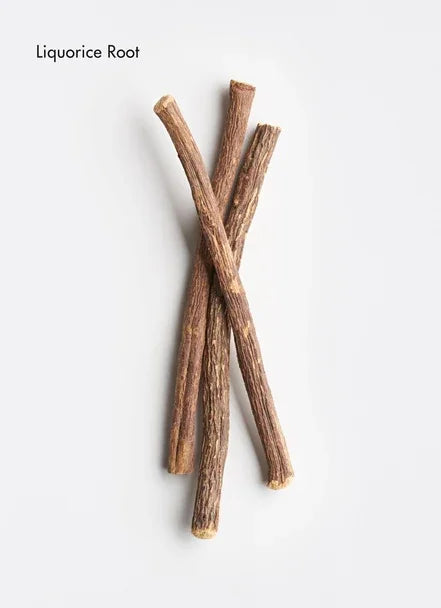 Three sticks of dried liquorice root on a white background, known for its soothing properties in skincare.