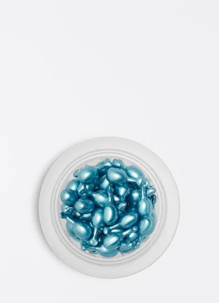 Blue hydrating capsules in a clear container, designed to boost skin moisture and softness with hyaluronic acid.