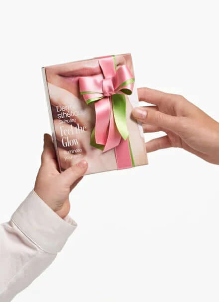 Gift set 'Feel the Glow' being exchanged, celebrating beauty for Mother's Day.