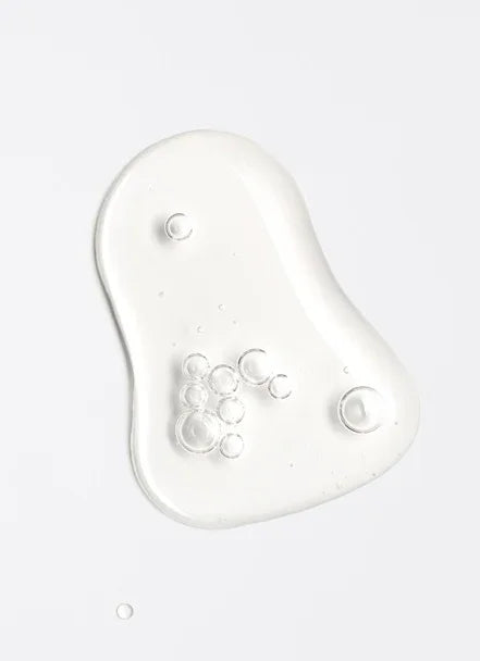 Transparent gel texture with bubbles, ideal for Spa Wellness Hair Shampoo promoting hair and scalp hydration.