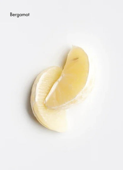 Fresh bergamot slices showcasing their vibrant yellow color on a clean background.